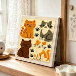 Quirky multi-coloured kitty punch needle artwork displayed on a table