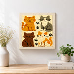 Finished quirky multi-coloured kitty artwork displayed on a wall