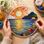Creating the radiant sun, blooming roses and blue waves wool painting by hand with a felting needle