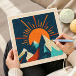 Creating handmade radiant sunburst and snowy peaks punch needle artwork