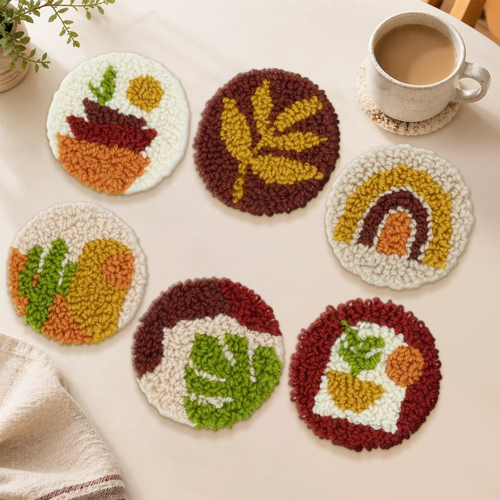 Rainbow and plant punch needle coasters used for home decoration