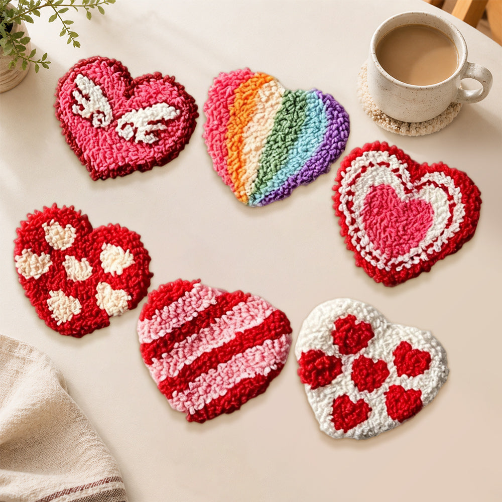 Rainbow and winged heart punch needle coasters used for home decoration