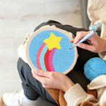 Creating handmade rainbow arcs and star punch needle artwork