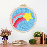 Finished rainbow arcs and star artwork displayed on a wall