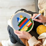 Creating handmade rainbow cat punch needle artwork