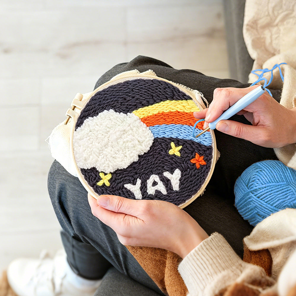 Creating handmade rainbow cloud and yay text punch needle artwork