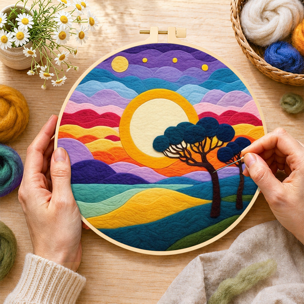 Creating the rainbow layered clouds and savannah trees wool painting by hand with a felting needle