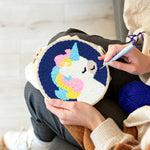 Creating handmade rainbow mane unicorn punch needle artwork