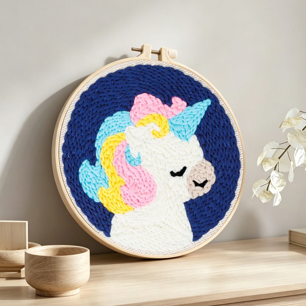Rainbow mane unicorn punch needle artwork displayed on a table