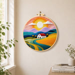 Rainbow mountains at sunset needle felt wall art displayed in a bright home interior