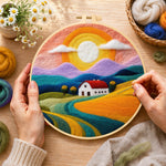 Creating the rainbow mountains at sunset wool painting by hand with a felting needle