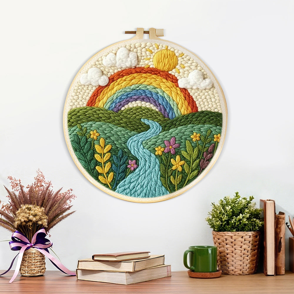 Finished rainbow over the rolling river and green fields artwork displayed on a wall