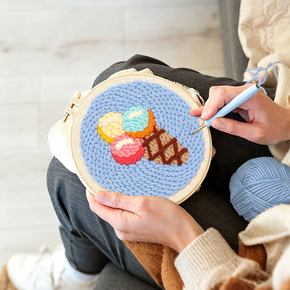 Creating handmade rainbow scoop ice cream cone punch needle artwork