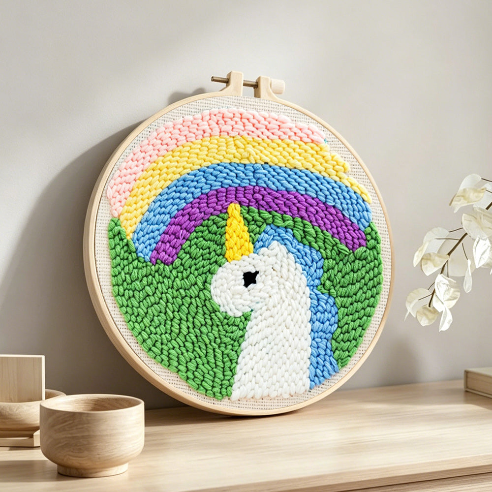 Rainbow unicorn punch needle artwork displayed on a table
