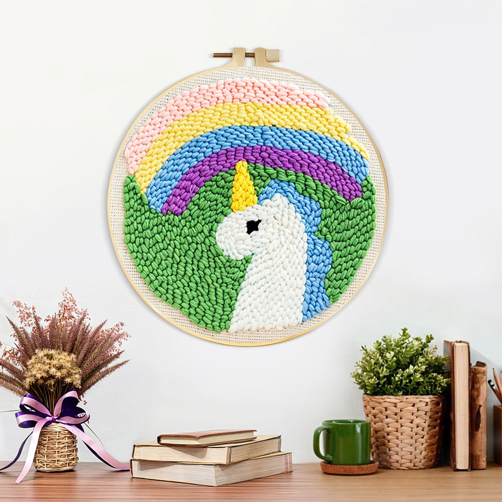 Finished rainbow unicorn artwork displayed on a wall