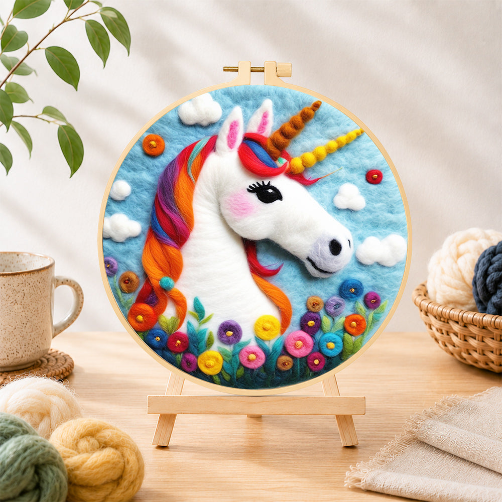 Finished rainbow unicorn with flowers needle felting displayed on a wooden easel