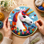 Creating the rainbow unicorn with flowers wool painting by hand with a felting needle