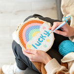 Creating handmade rainbow with lucky text punch needle artwork