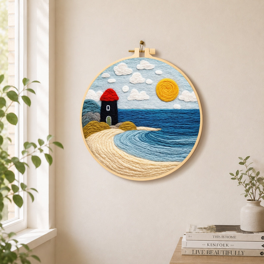 Red and black lighthouse by the sea needle felt wall art displayed in a bright home interior