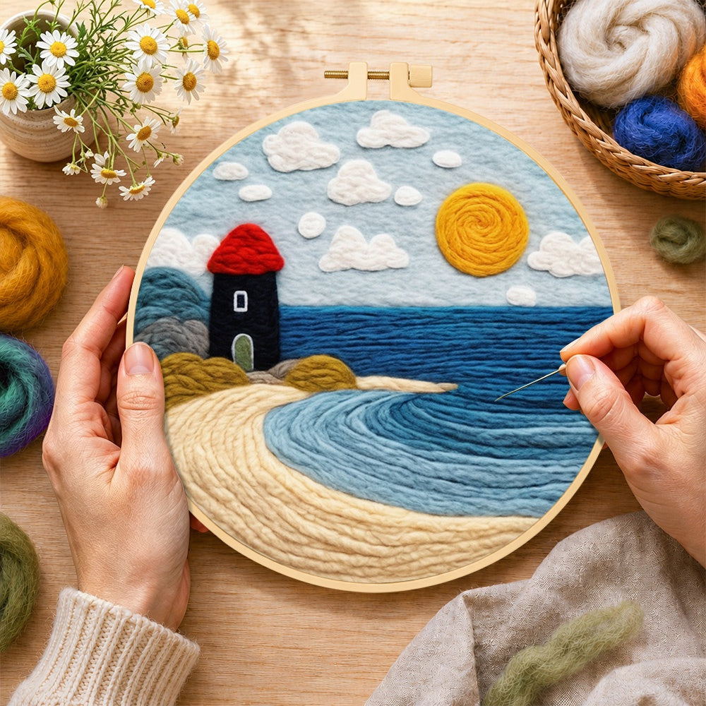 Creating the red and black lighthouse by the sea wool painting by hand with a felting needle