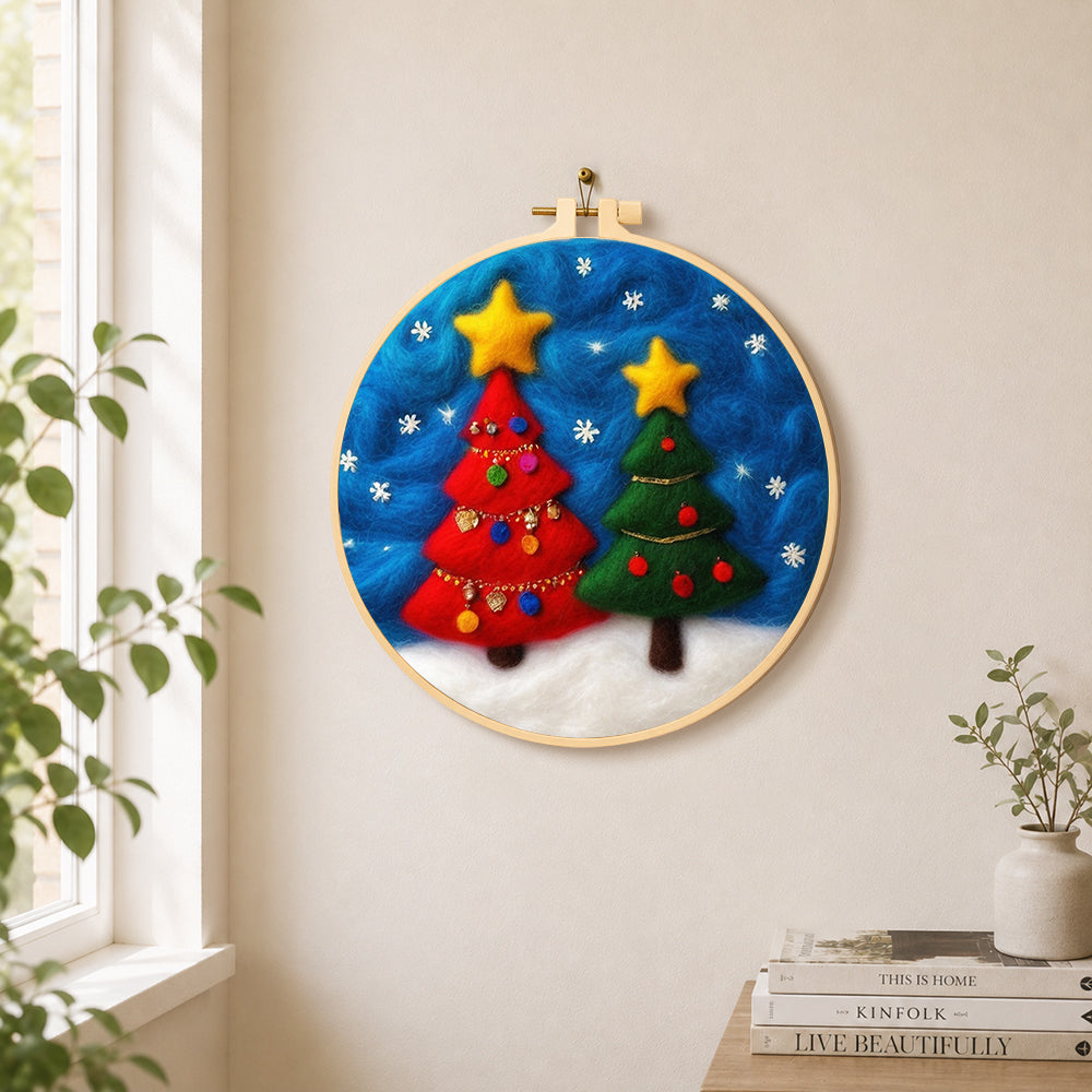 Red and green christmas trees with snowflakes needle felt wall art displayed in a bright home interior