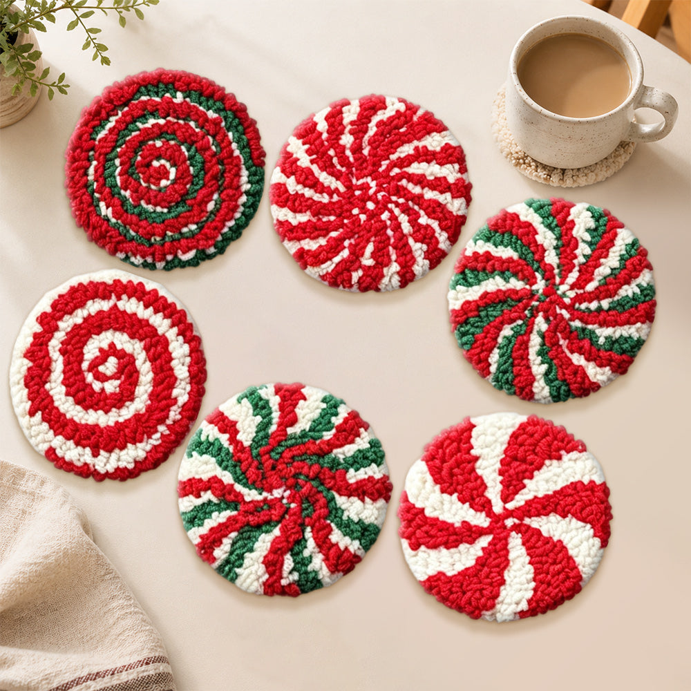 Red and green swirl candy punch needle coasters used for home decoration
