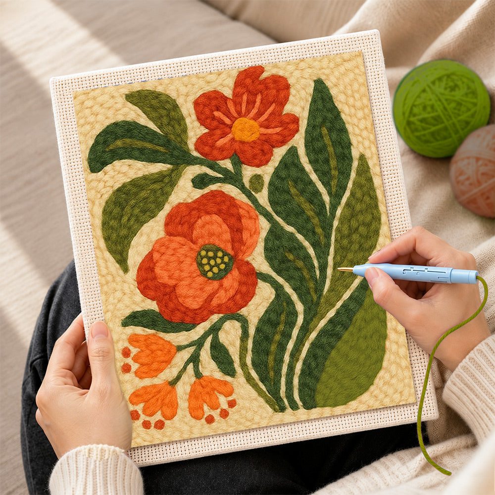 Creating handmade red and orange floral with leaves punch needle artwork