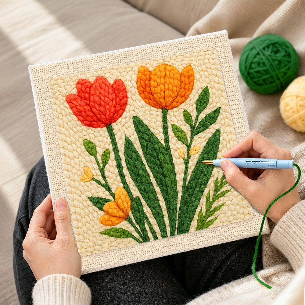 Creating handmade red and orange tulips on the creamy background punch needle artwork