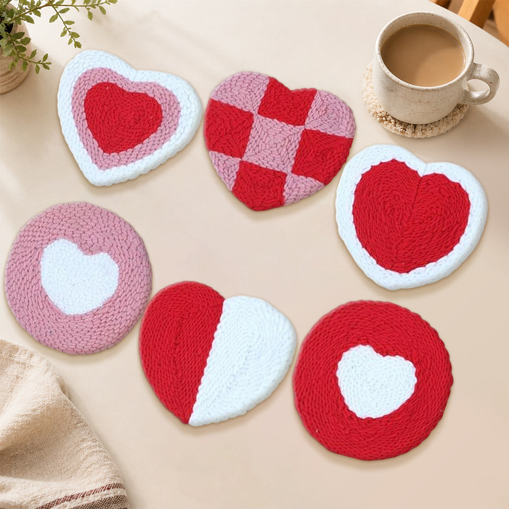 Red and pink checkered heart punch needle coasters used for home decoration