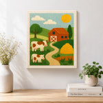 Finished red barn and cows landscape artwork displayed on a wall