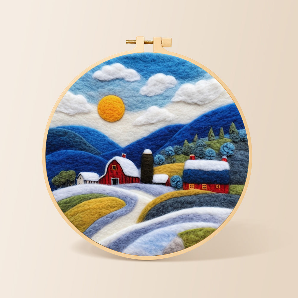 Red barn and snowy blue hills needle felting kit for beginners with a round wooden frame