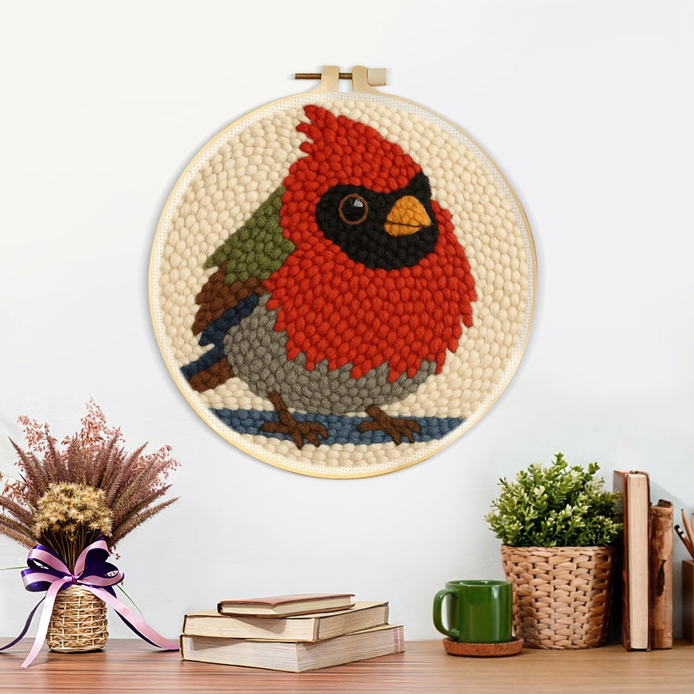 Finished red cardinal bird artwork displayed on a wall