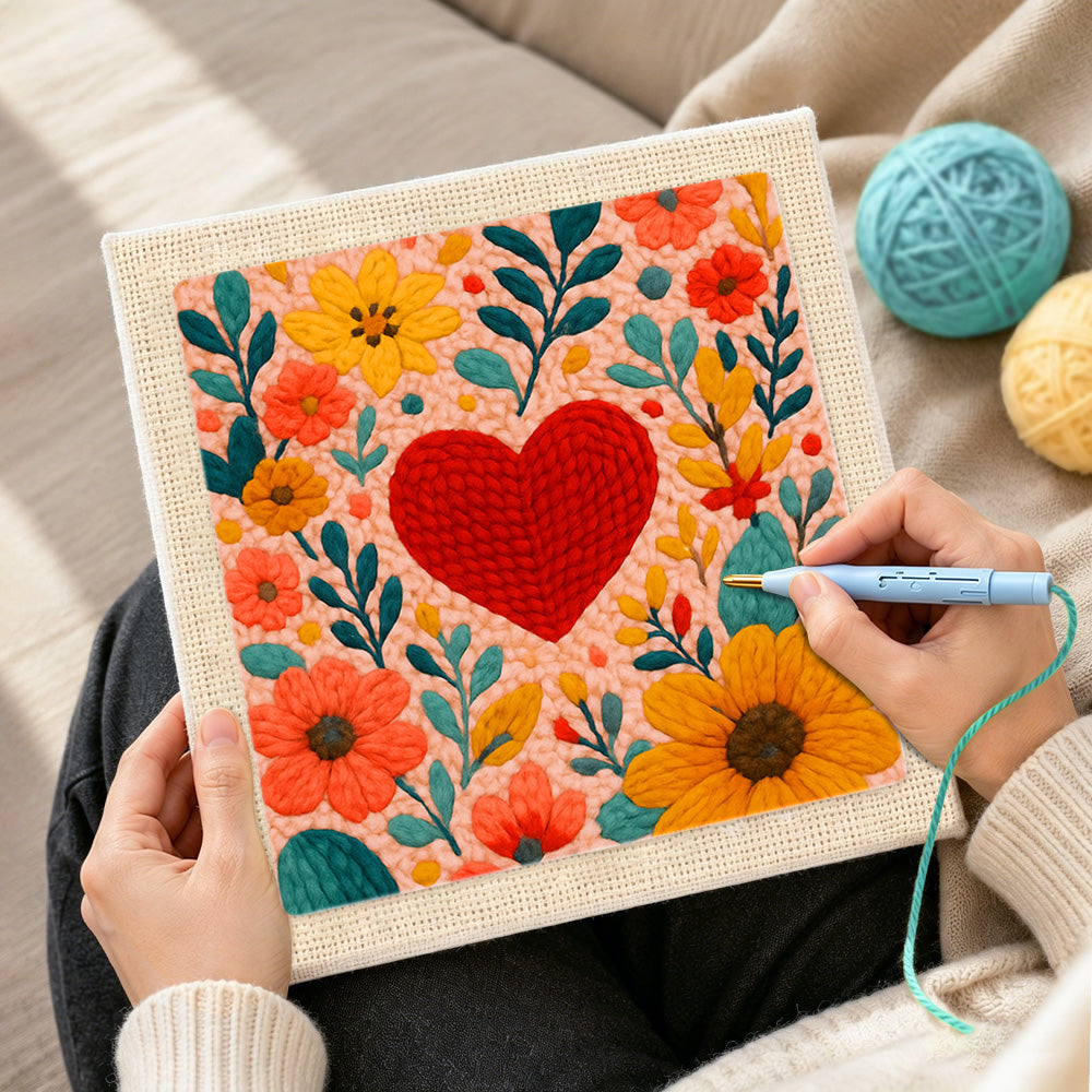 Creating handmade red heart surrounded by colourful blooms punch needle artwork