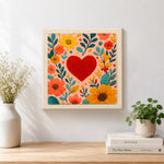 Finished red heart surrounded by colourful blooms artwork displayed on a wall