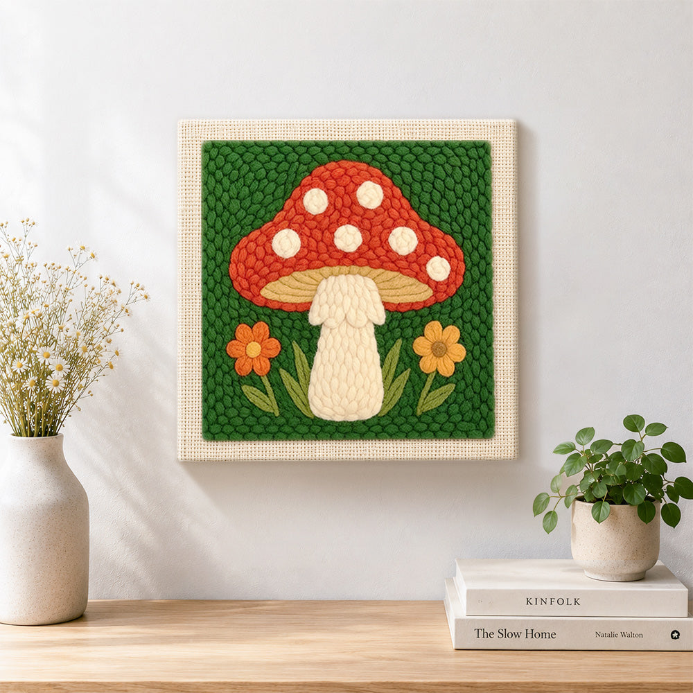 Finished red mushroom with white spots artwork displayed on a wall