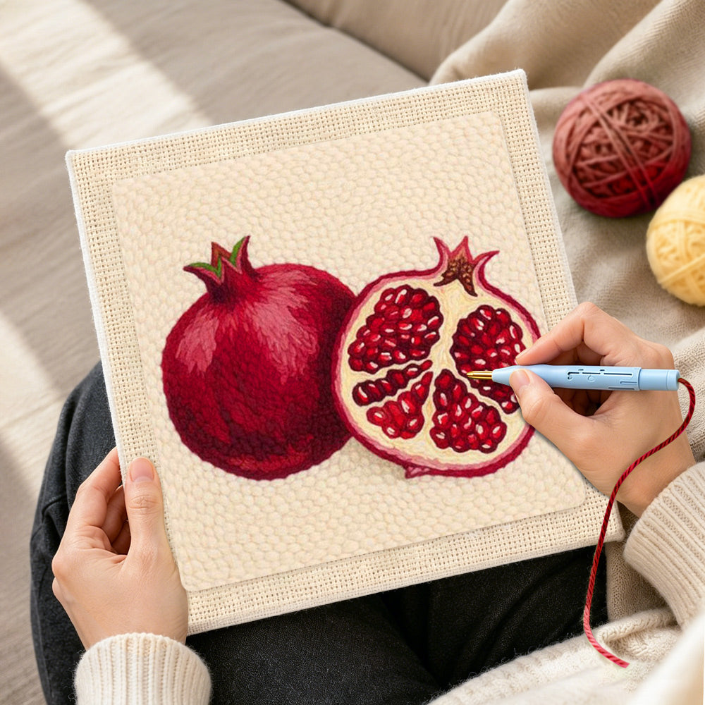 Creating handmade red pomegranate punch needle artwork