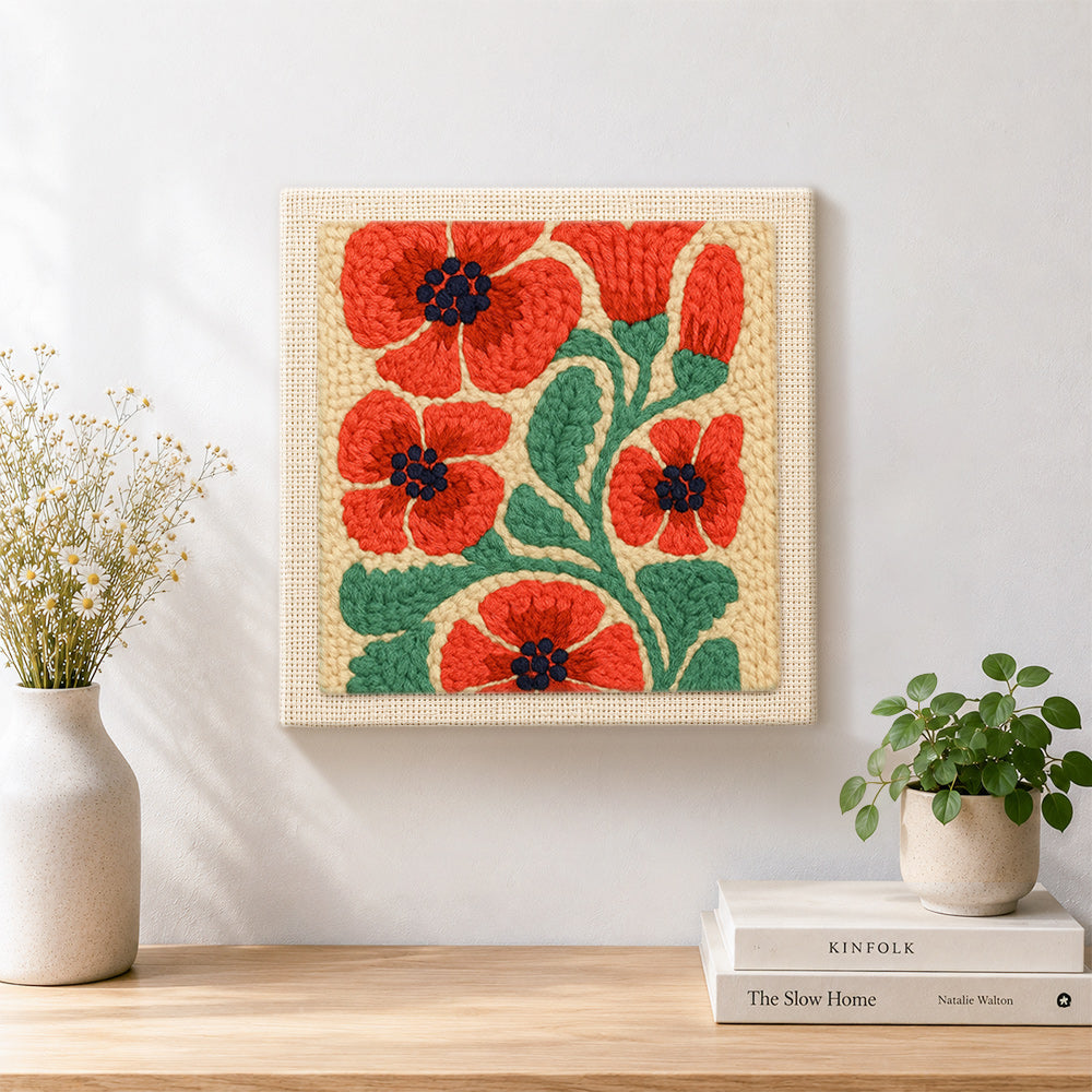 Finished red poppies artwork displayed on a wall