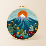 Red sun over snowy peaks needle felting kit for beginners with a round wooden frame
