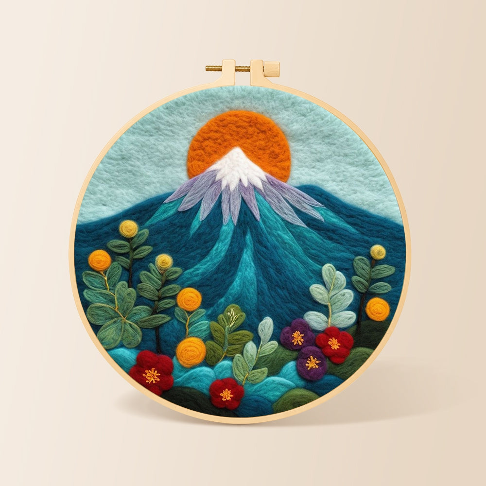 Red sun over snowy peaks needle felting kit for beginners with a round wooden frame