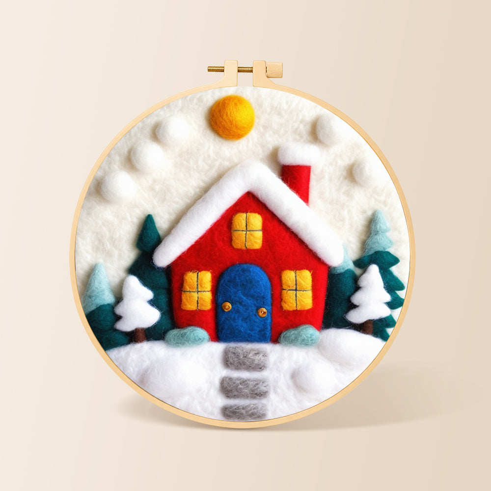 Red winter house with blue door needle felting kit for beginners with a round wooden frame