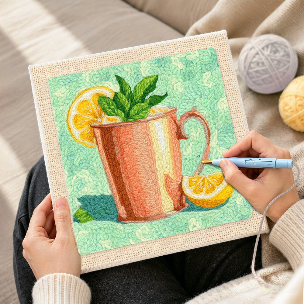 Creating handmade refreshing mint and lemon drink punch needle artwork