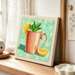 Refreshing mint and lemon drink punch needle artwork displayed on a table