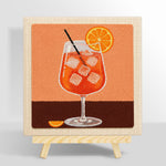 Refreshing orange cocktail with ice cubes punch needle kit for beginners