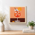 Finished refreshing orange cocktail with ice cubes artwork displayed on a wall