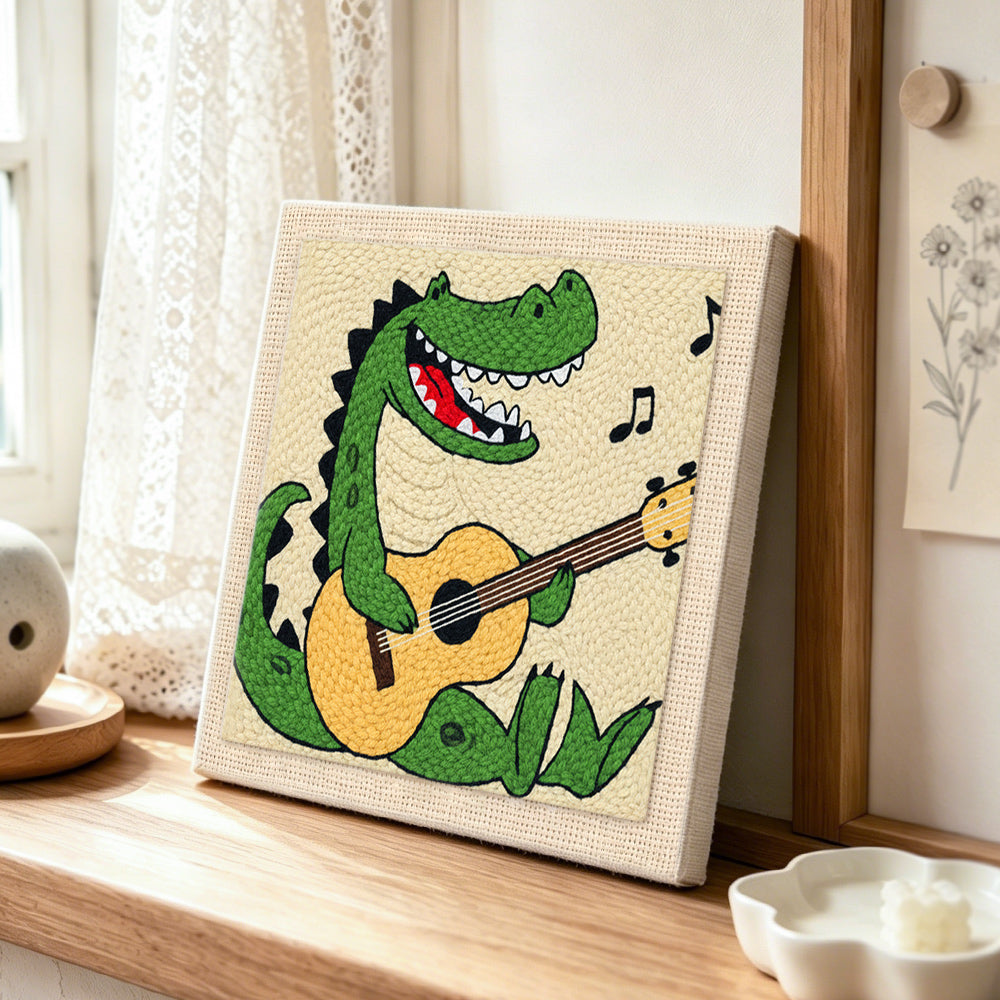 Rockstar crocodile playing guitar punch needle artwork displayed on a table