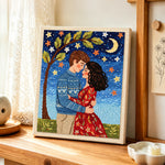 Romantic embrace under the moon punch needle artwork displayed on a table