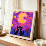 Romantic starry night cat couple punch needle artwork displayed on a table