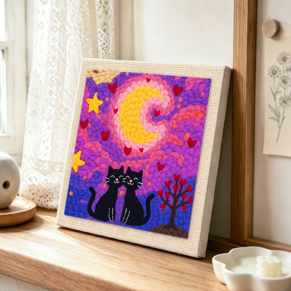 Romantic starry night cat couple punch needle artwork displayed on a table