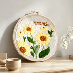 Romantic yellow sunflowers punch needle artwork displayed on a table