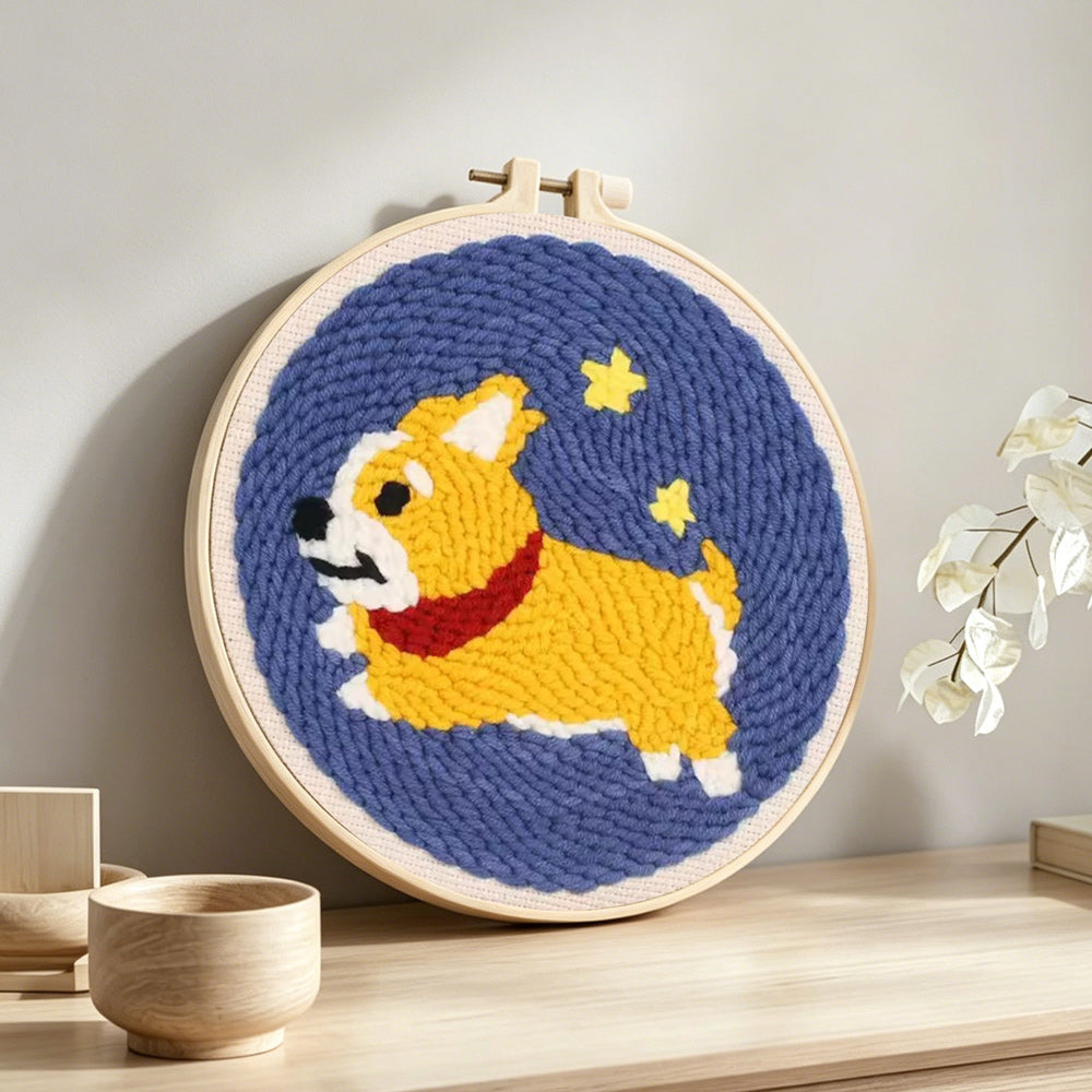 Running corgi with stars punch needle artwork displayed on a table